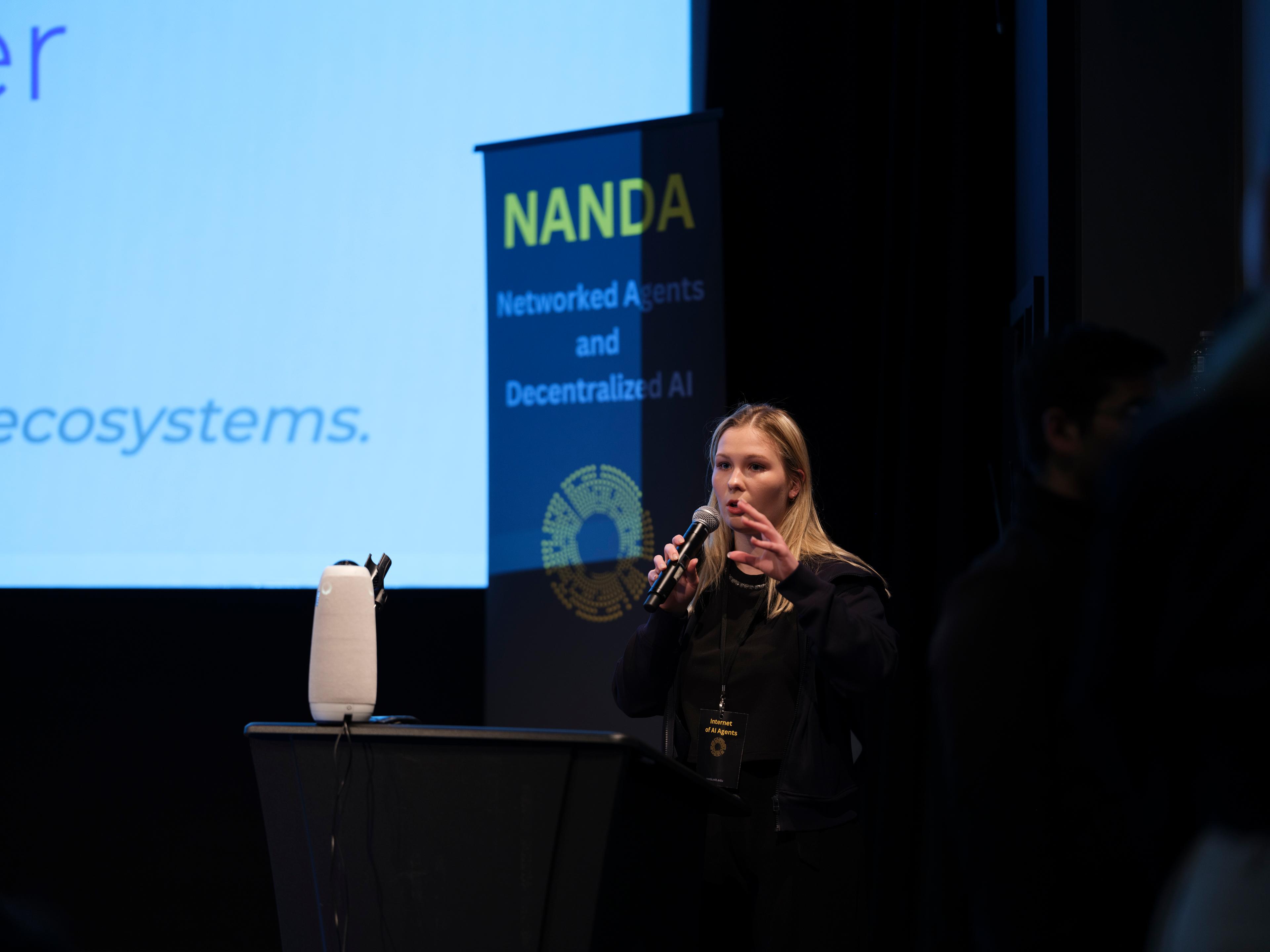 Project NANDA fellow presenting on stage at a NANDA event